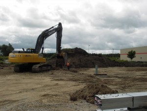 Excavating the soil for the eventual parking lot